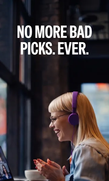 Paywall photo: a woman in purple headphones laughing at her laptop.